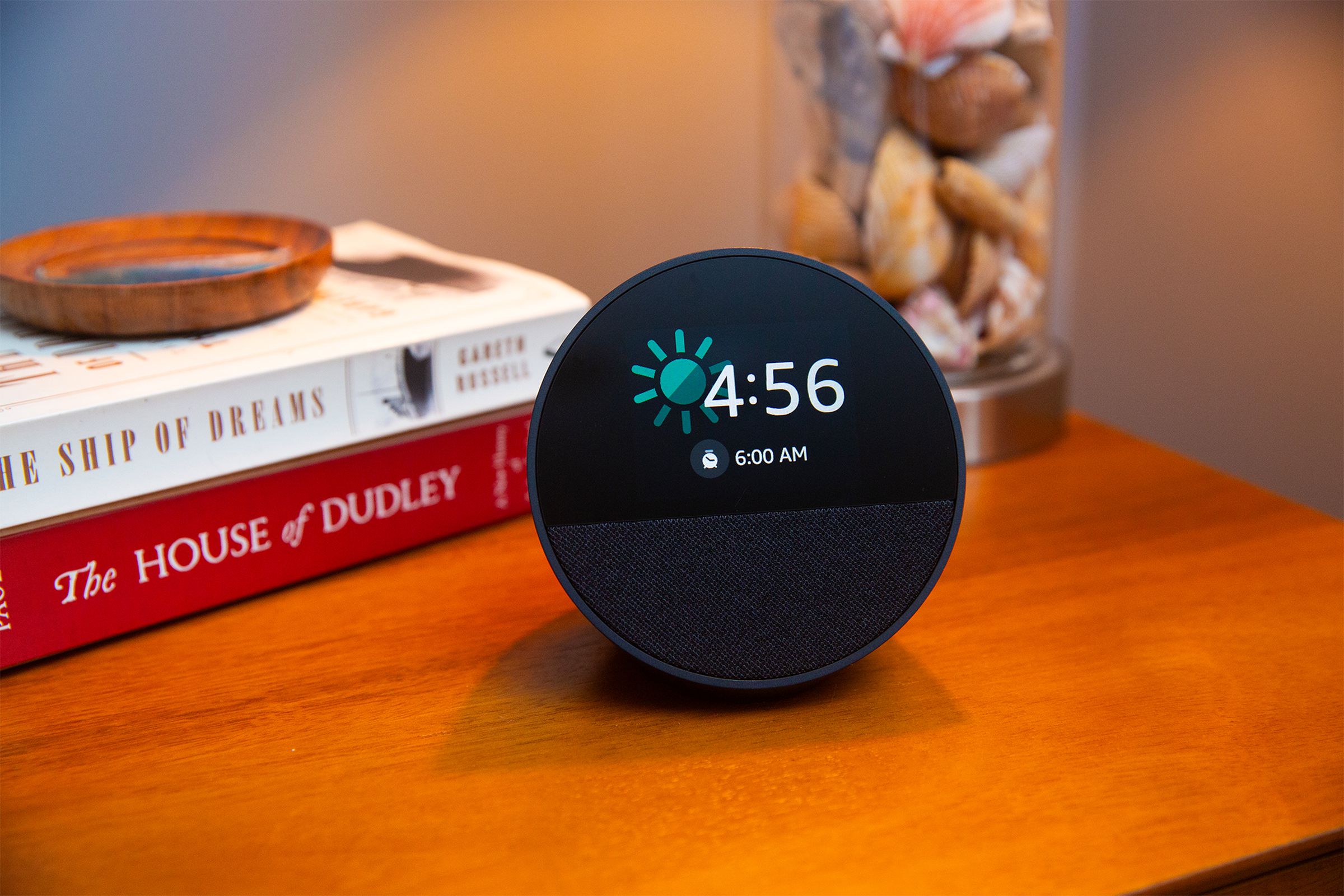 Photo of an Echo Spot sitting on a nightstand.