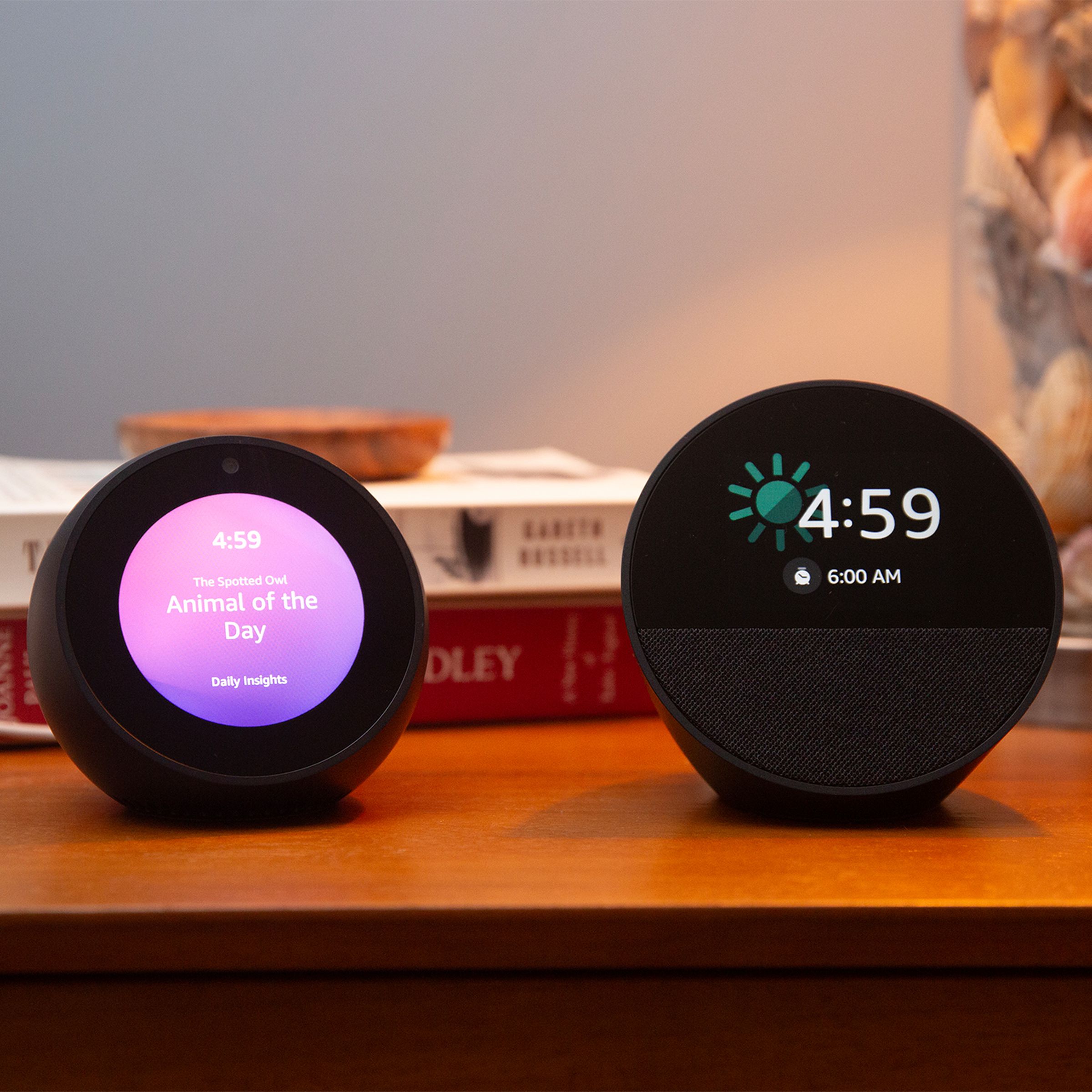 Photo of an Echo Spot sitting on a nightstand.