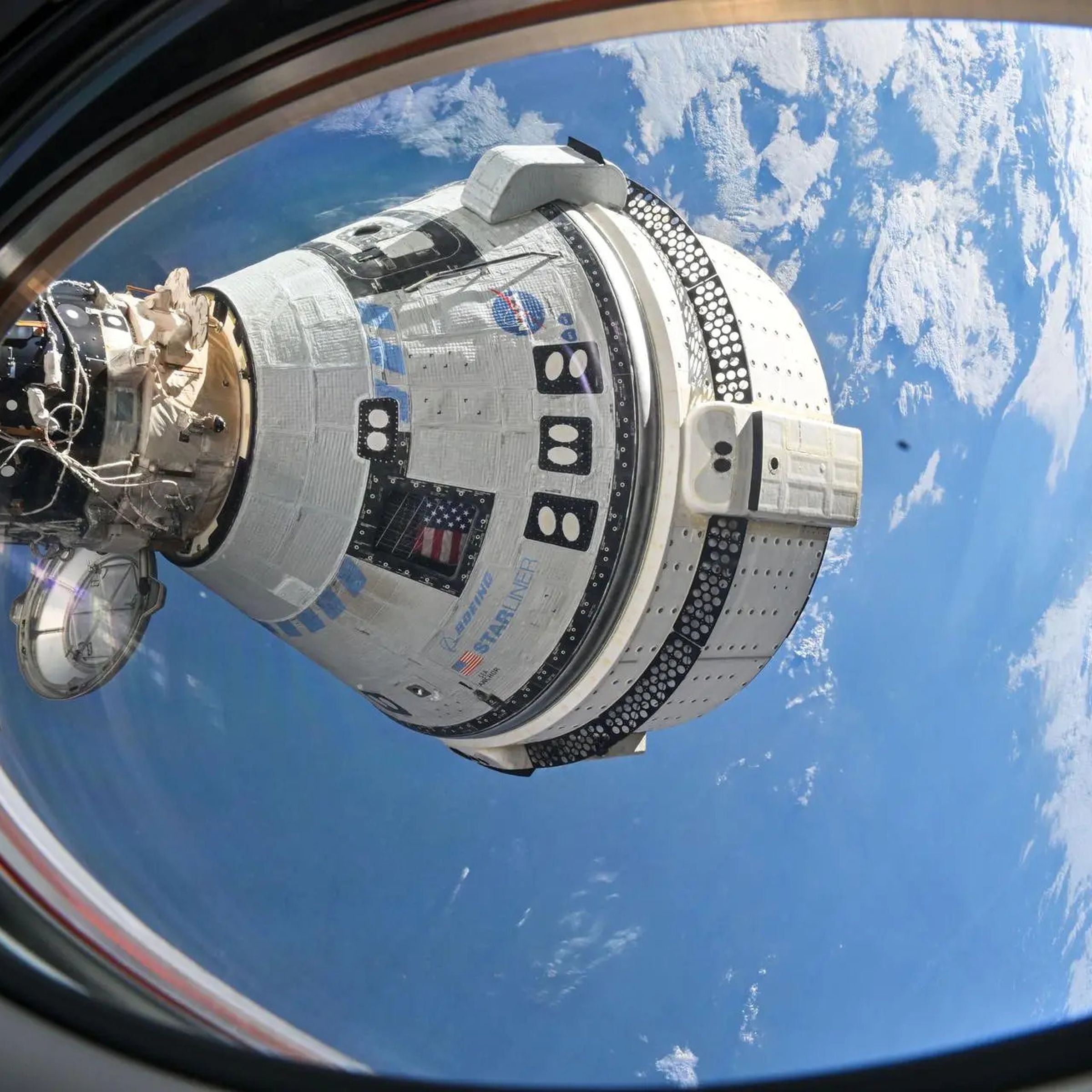 A photo showing the Starliner spacecraft docked at the ISS